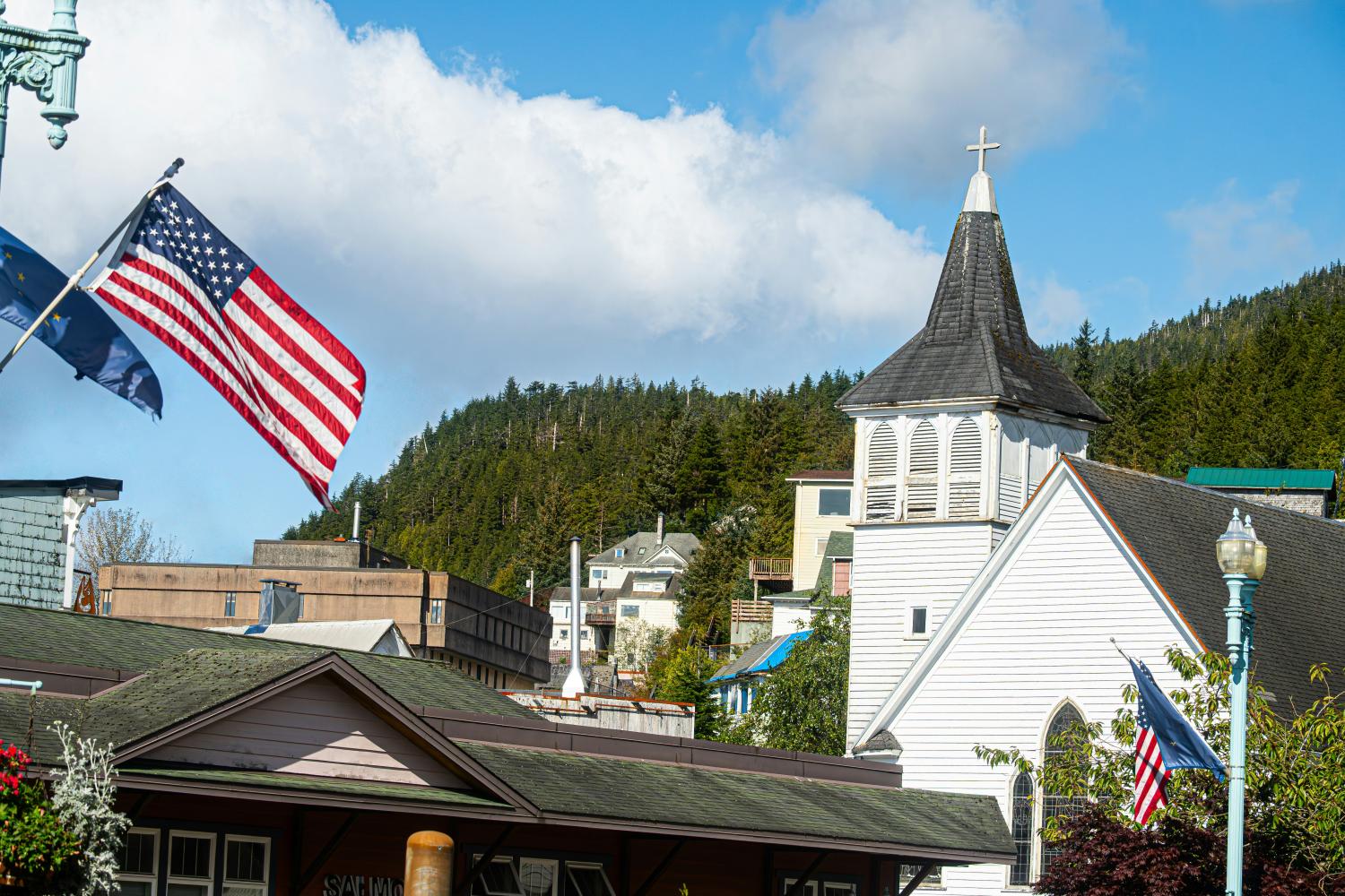 american flag near church