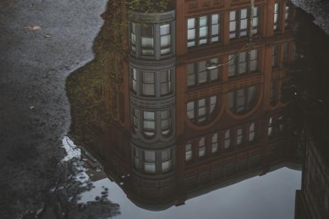 Building Reflected in a Puddle