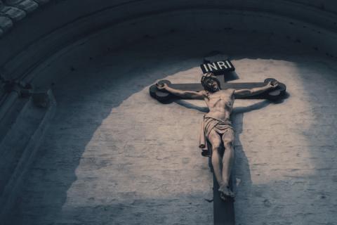 A stone crucifix in the sunlight