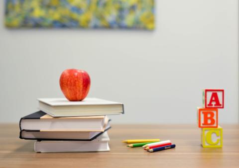 School supplies and an apple